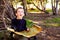 A clever boy searches an ancient map for something buried in a forest