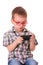 Clever kid is playing with smart cell phone