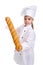 Clever serious chef girl in a cap cook uniform, presenting the long loaf of bread. Looking at the camera. Portrait image