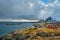 Clif with traditional red rorbu house on Lofoten Islands, Norway