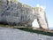 Cliff with arch on pebble beach of Etretat