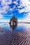 The cliff in Bay of Hoonah during low tide at sunset