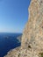 Cliff on a blue sea to Amorgos in Greece.