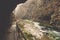 Cliff boardwalk with shore covered in moss and Radovna river