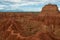 Cliff with cactus and valley of red orange sand