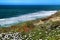 Cliff edge looking at the Atlantic Ocean and covered with vegetation