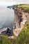 Cliff of Moher, county Clare, Ireland. Famous Irish tourist destination. Calm Atlantic ocean, green grass