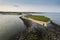 Cliff near Silverstrand beach and car park in Galway city, Ireland. Popular tourist place with stunning view on Galway bay and