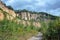 Cliff at old closed down and overgrown sandstone and Rhyolite quarry pit in the Odenwald mountain range in Germany