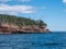 Cliff of rock mountain with thousands of northern gannets Bonaventure Island Gaspesie, Quebec, Canada