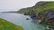 Cliffs along Irish Coast next to tiny Carrick-a-rede island