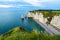 Cliffs Aval and Needle of Etretat and beautiful famous coastline during the tide. Normandy, France