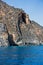 Cliffs with caves surrounding Domata beach, a view from ferry ona way between Agia Roumeli and Sougia, south-west of Crete island