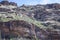 Cliffs with exposed sedimentary rock layers at Sabino Canyon, Tucson, Arizona