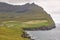 Cliffs in Faroe islands coastline. Vidareidi village in Vidoy