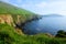 Cliffs and green fields of the coast at Dunquin Harbour, Dingle peninsula, County Kerry, Ireland