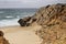 Cliffs at Guincho beach under cloudy sky in Portugal