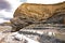 The cliffs at Kilve beach near East Quantoxhead in Somerset, England. Stratified layers of rock date back to the Jurassic era and