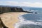 Cliffs and large half moon shaped beach, Pacific Ocean Coast, Half Moon Bay, California