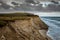 Cliffs in Lonstrup, Rubjerg Knude lighthouse on a dune in the background, north Jutland, Denmark