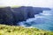 Cliffs of Moher at Alantic Ocean in Western Ireland with waves battering against the rocks