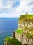 Cliffs of Moher and O`Brien`s tower, west coast of Ireland, County Clare at wild atlantic ocean.