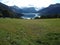 Cliffs, mountains and field near Norway fjord