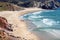 Cliffs over sunny beach with surfers of Atlantic ocean. Portugal seaside and waves under hot sun