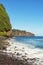 Cliffs and Pacific Ocean from rocky beach Hawaii