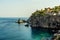 Cliffs and rock stacks along the coastline of Taormina, Sicily