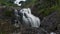 Cliffs with soft waterfalls in the hills