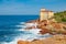 Cliffs of the Tuscan coast, overlooking the sea stands the castle of Boccale, medieval manor with watchtower in Livorno
