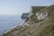 Cliffs, waters and meadows, Durdle Door, England.