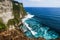 Cliffs and waves near Uluwatu Temple on Bali, Indonesia