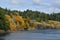 Cliffside houses surrounded by beautiful autumn colors and evergreens.