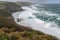 clifftop vista, with the waves crashing against the rocks below