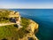 Cliffy coast with Alfazinha Lighthouse in Carvoeiro, Algarve, Portugal