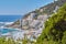 Clifton, Cape Town, South Africa panorama seascape with clouds, blue sky, hotels, and apartment buildings in the