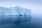 Climate change and global warming. Icebergs from a melting glacier in Greenland. UNESCO