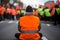 Climate change protest activists wearing hi vis jacket sit on a road and block traffic