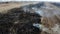 Climate emergency and change. Global warming. aerial drone fly over view of a grass fire. Version 3