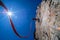 Climber abseiling the steep rock