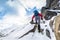 A climber ascending a snow covered ridge