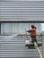 Climber cleaning a building facade