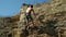 Climber Climbing On A Cliff
