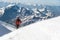 The climber climbs the snow-covered summit.