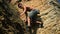 Climber Descending On A Rock