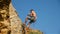 Climber Descends On A Rope