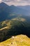 Climber descends the steep slope of mountain