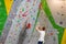 Climber explores and develops a route on a climbing wall in the boulder hall